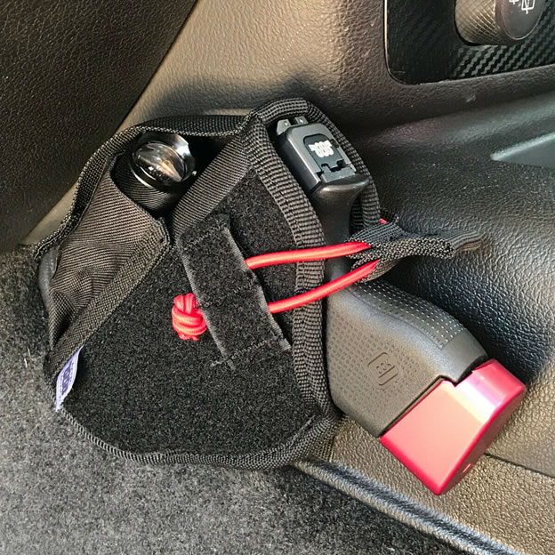 Transporting weapon in car gun holsters